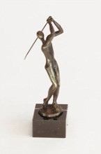 Bronzen sculptuur van een golfer